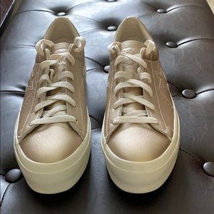 Women’s gold converse sneakers